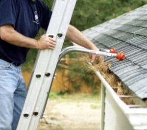 MM Handyman installing gutter covers on a single-story home in Brentwood CA.